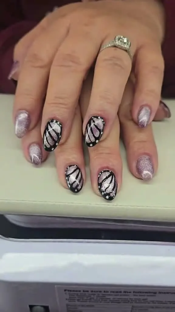 Monochrome Monarch butterfly nail design