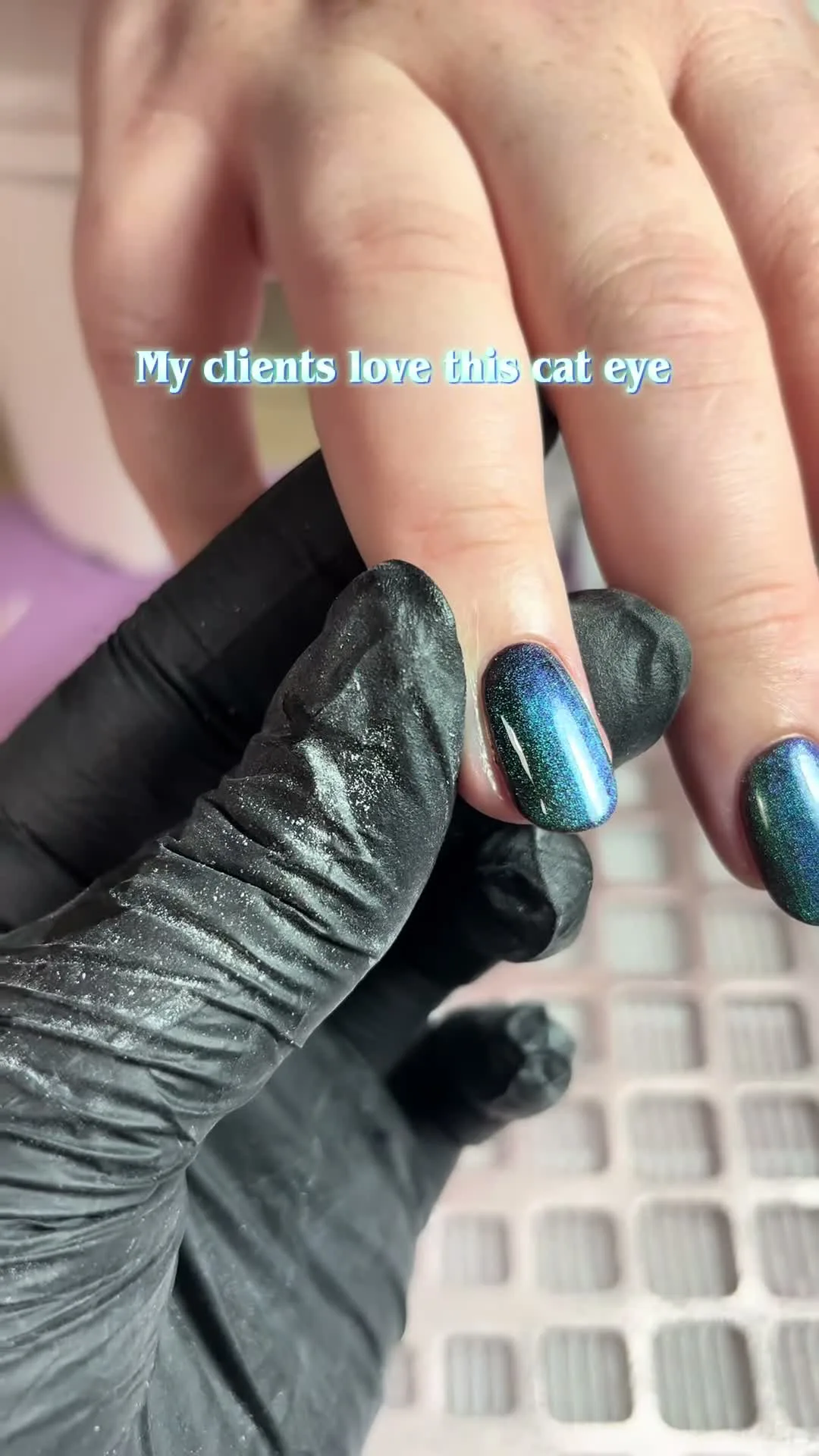 Peacock cat-eye nail design