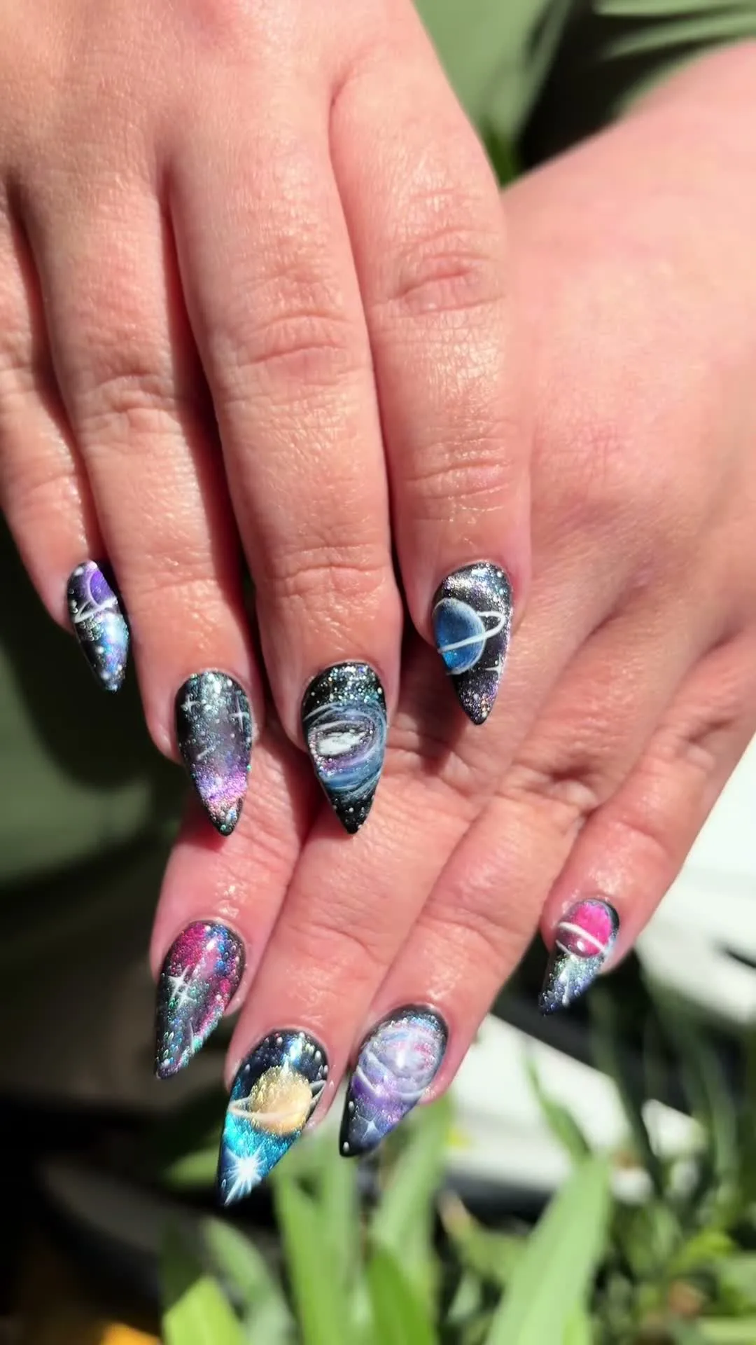 Cosmic Claws cat-eye nail design