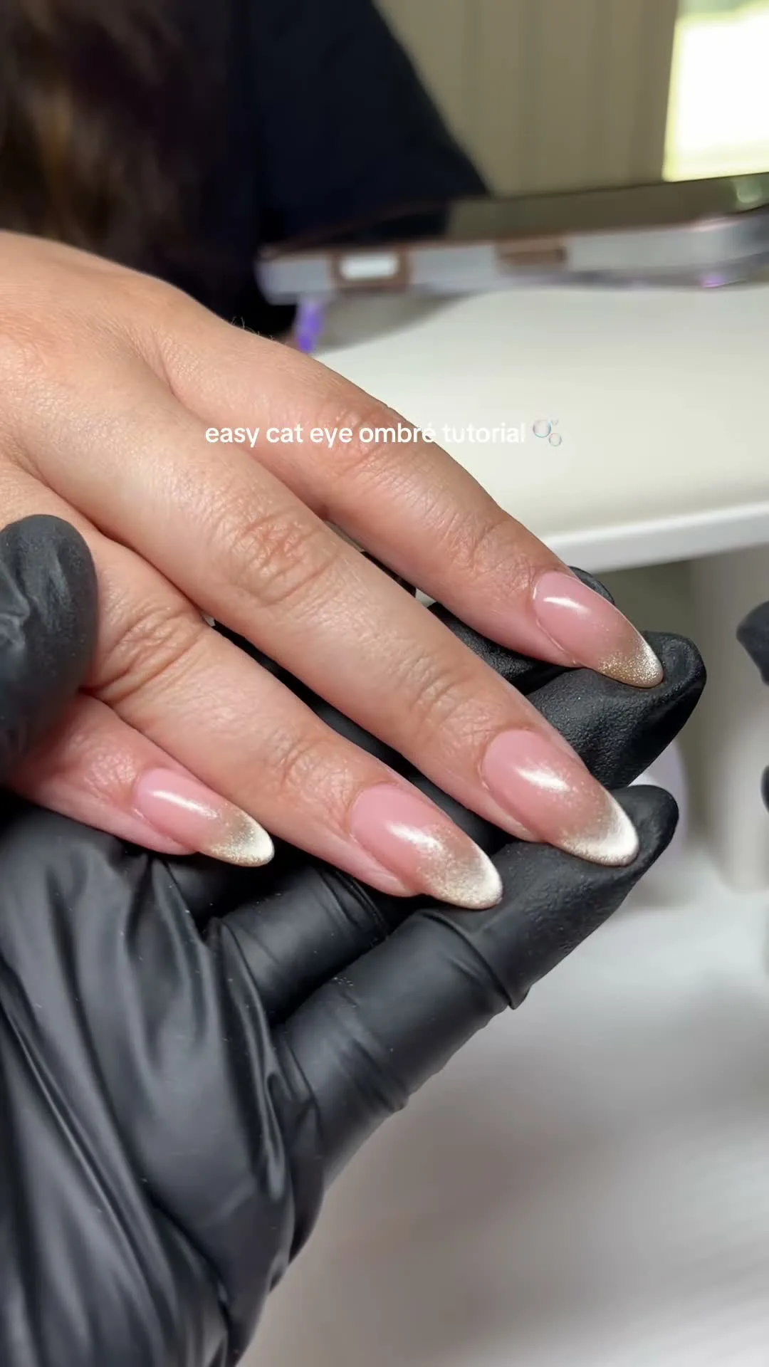 Nude Whisper cat-eye nail design