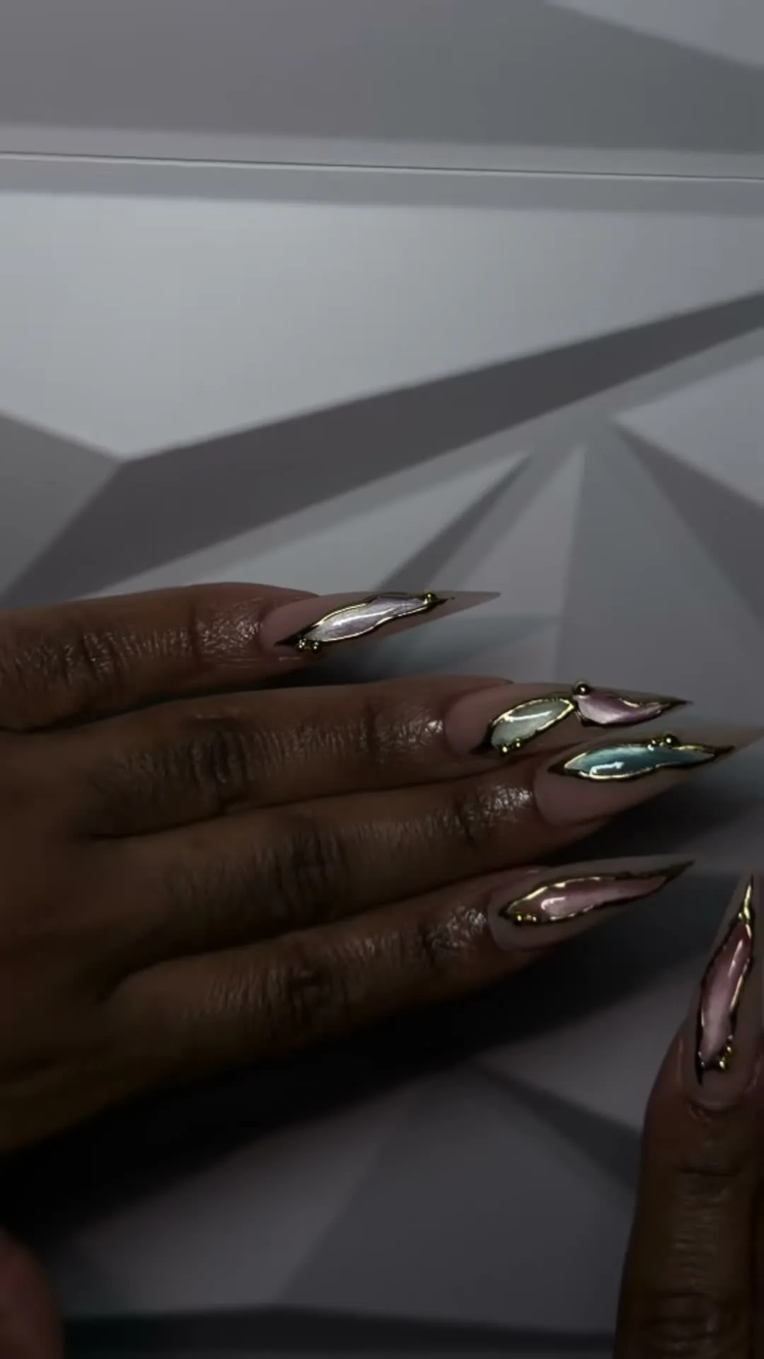 Onyx Chrome cat-eye nail design